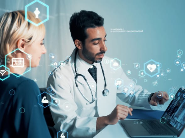 Doctor presenting patient health data on a tablet to a patient during a consultation