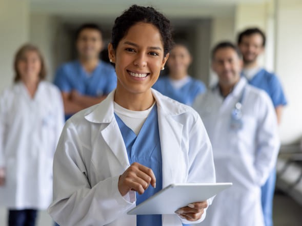 Team of doctors with one doctor in focus and a blurred background