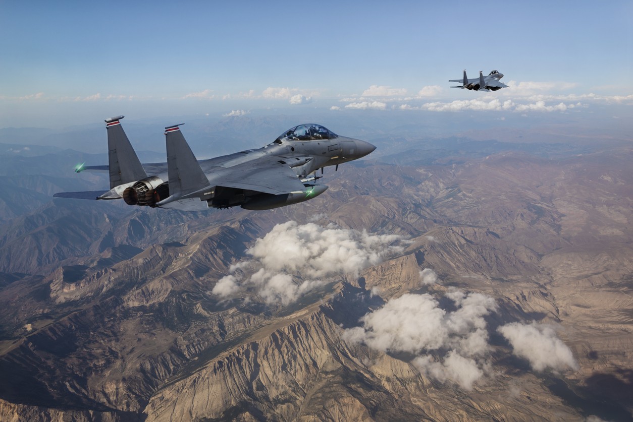 F-15 Fighter Jets flying over mountains